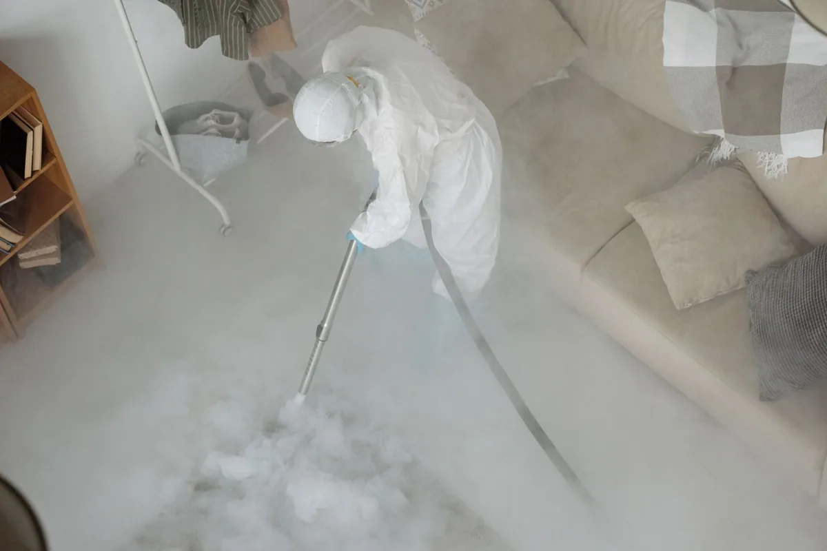Biohazard cleanup technician in protective equipment, Reading, OH